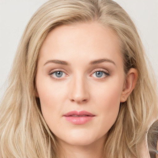 Joyful white young-adult female with long  brown hair and blue eyes