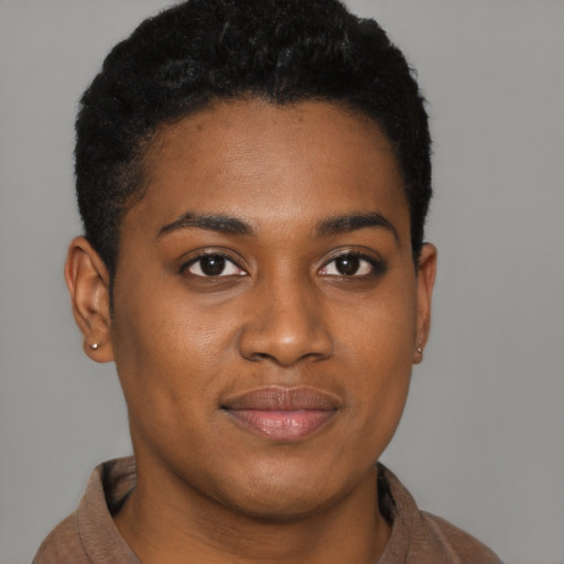 Joyful black young-adult female with short  brown hair and brown eyes