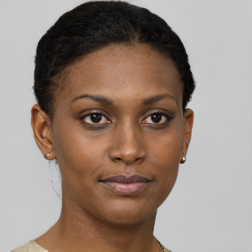 Joyful black young-adult female with short  brown hair and brown eyes