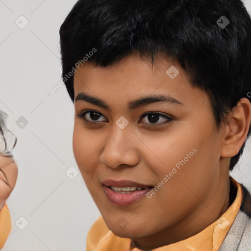 Joyful asian young-adult female with short  black hair and brown eyes