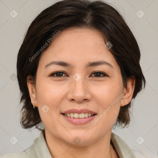 Joyful white adult female with medium  brown hair and brown eyes