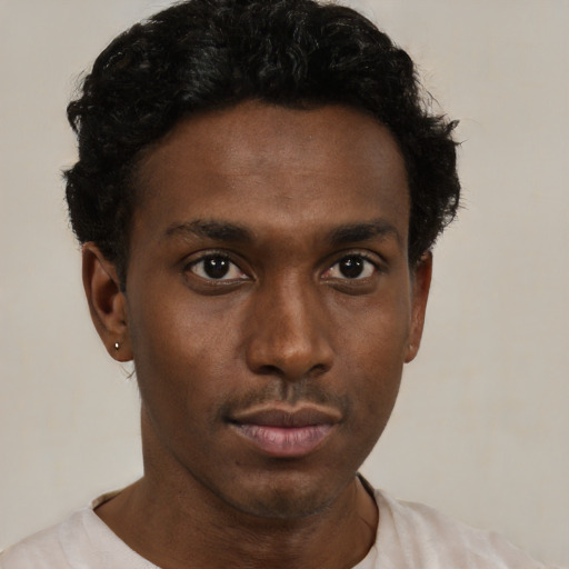 Neutral black young-adult male with short  black hair and brown eyes