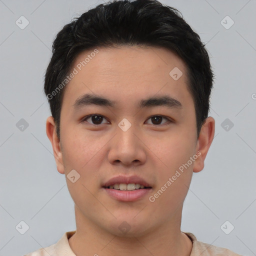 Joyful asian young-adult male with short  black hair and brown eyes