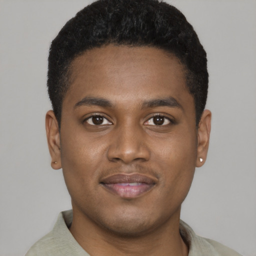 Joyful black young-adult male with short  black hair and brown eyes
