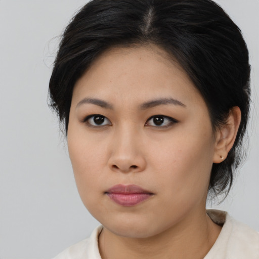 Neutral asian young-adult female with medium  black hair and brown eyes