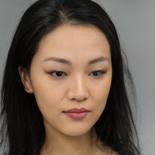 Neutral asian young-adult female with long  brown hair and brown eyes