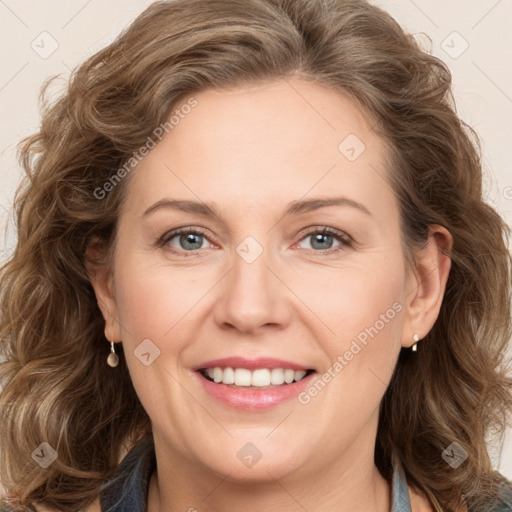 Joyful white adult female with medium  brown hair and blue eyes