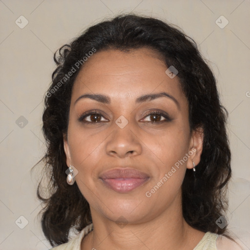 Joyful black adult female with medium  brown hair and brown eyes