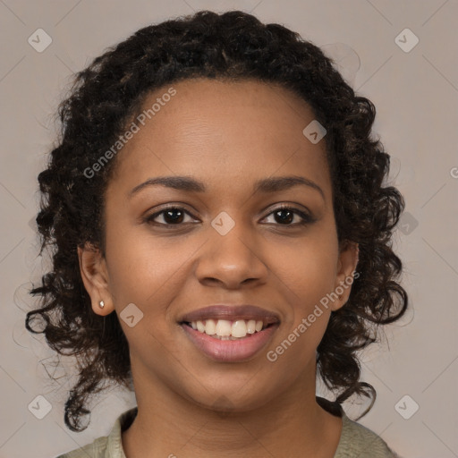 Joyful black young-adult female with medium  brown hair and brown eyes