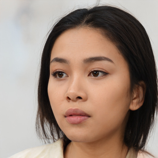 Neutral asian young-adult female with medium  black hair and brown eyes
