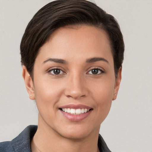 Joyful white young-adult female with short  brown hair and brown eyes