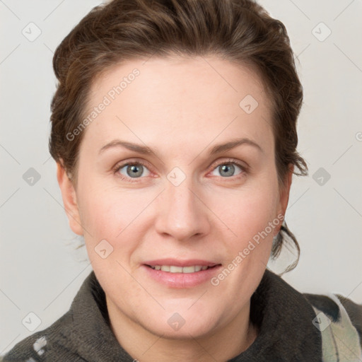 Joyful white young-adult female with short  brown hair and grey eyes