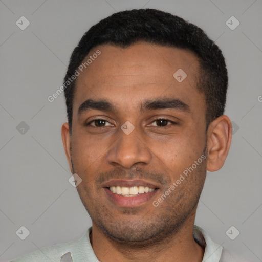 Joyful black young-adult male with short  black hair and brown eyes