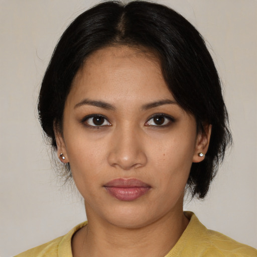 Neutral latino young-adult female with medium  black hair and brown eyes