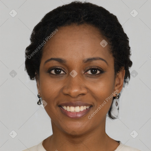 Joyful black young-adult female with short  black hair and brown eyes