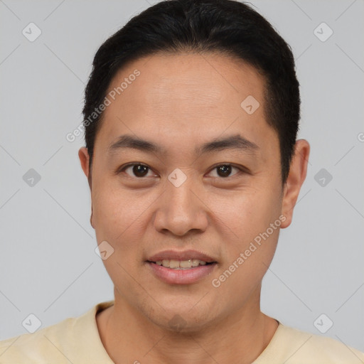 Joyful latino young-adult male with short  brown hair and brown eyes