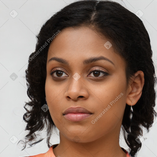 Joyful black young-adult female with medium  black hair and brown eyes