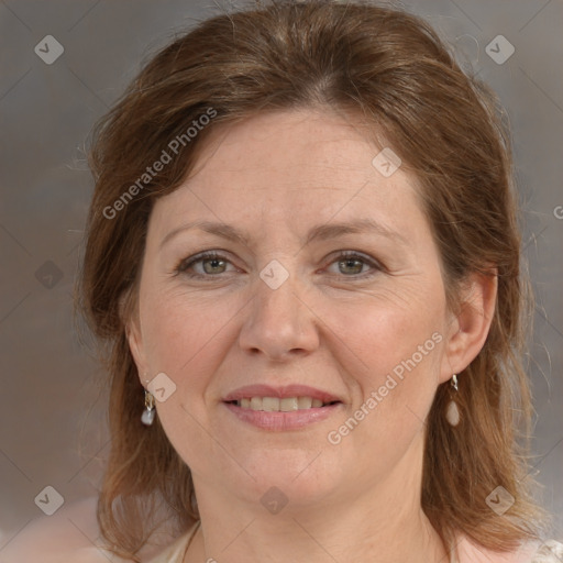 Joyful white adult female with medium  brown hair and grey eyes