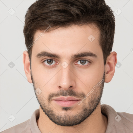 Neutral white young-adult male with short  brown hair and brown eyes