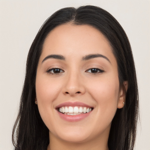 Joyful asian young-adult female with long  brown hair and brown eyes