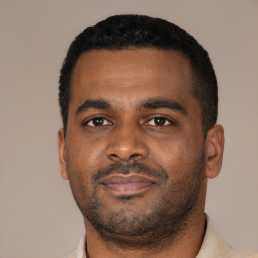 Neutral black young-adult male with short  black hair and brown eyes