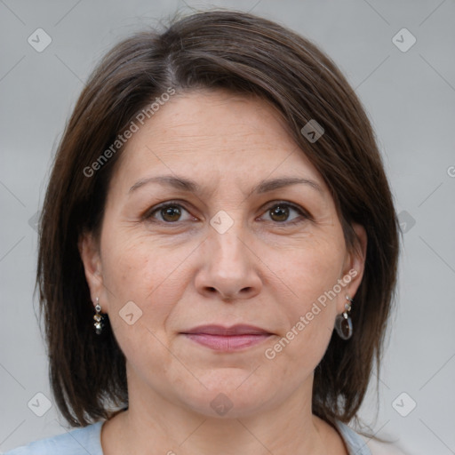 Joyful white adult female with medium  brown hair and grey eyes