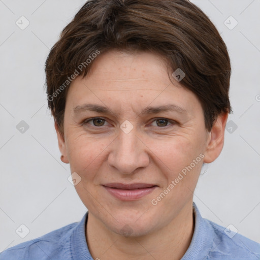 Joyful white adult female with short  brown hair and brown eyes