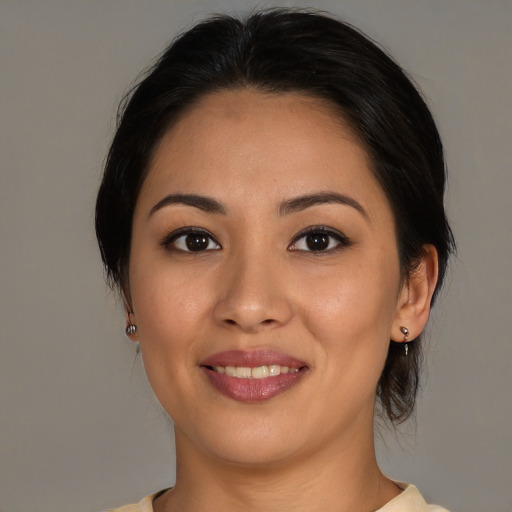 Joyful asian young-adult female with medium  brown hair and brown eyes