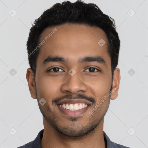 Joyful latino young-adult male with short  black hair and brown eyes