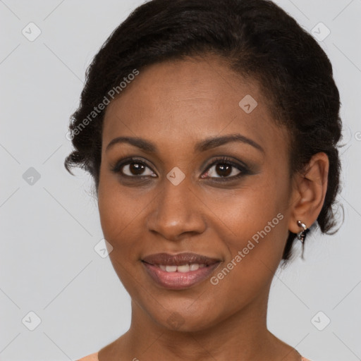 Joyful black young-adult female with short  brown hair and brown eyes