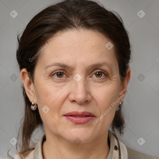 Joyful white adult female with medium  brown hair and brown eyes