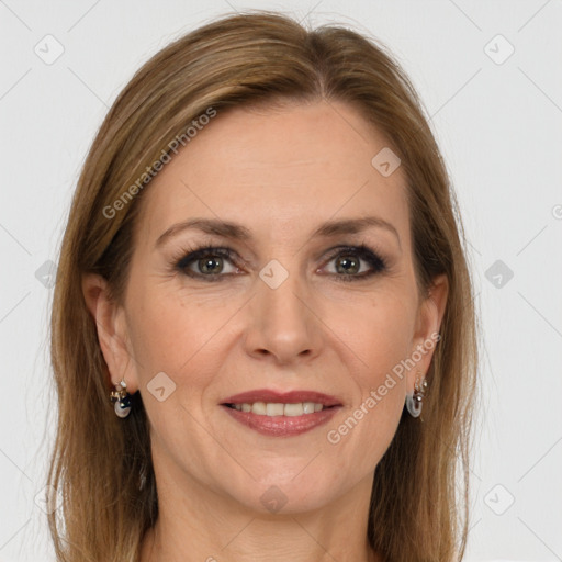 Joyful white adult female with long  brown hair and grey eyes