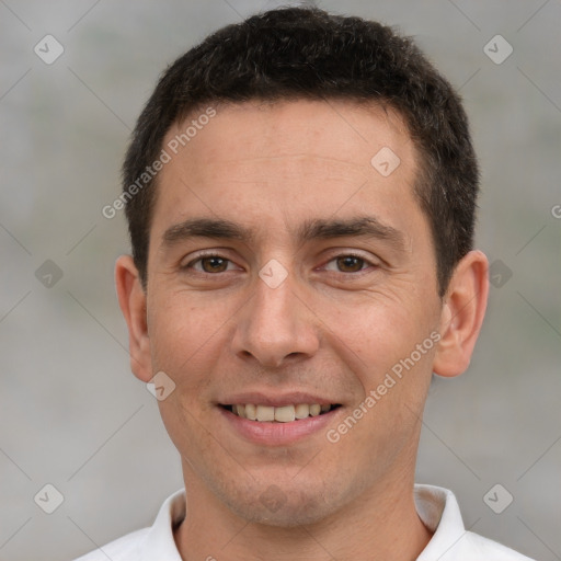 Joyful white young-adult male with short  brown hair and brown eyes