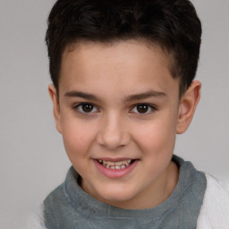 Joyful white child male with short  brown hair and brown eyes