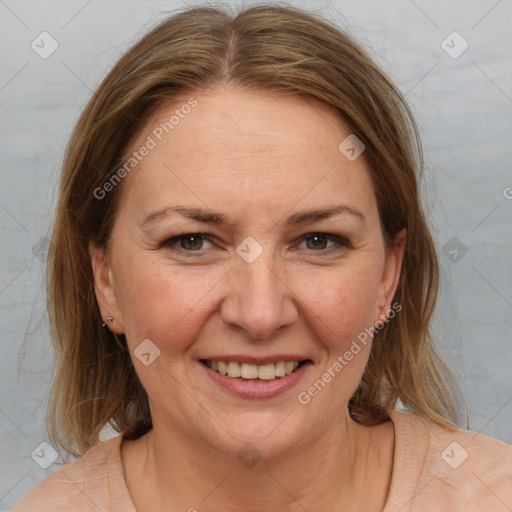 Joyful white adult female with medium  brown hair and brown eyes