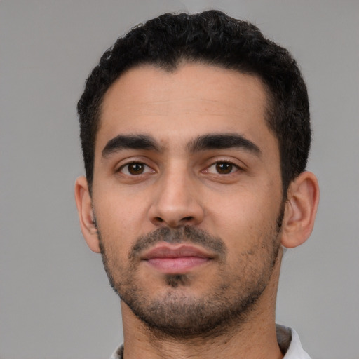 Neutral latino young-adult male with short  black hair and brown eyes
