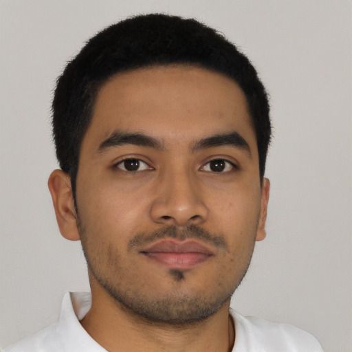 Neutral latino young-adult male with short  brown hair and brown eyes