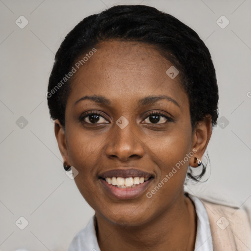 Joyful black young-adult female with short  black hair and brown eyes