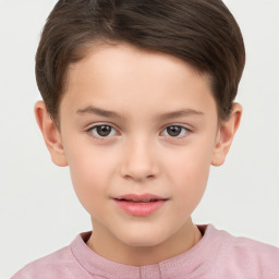 Joyful white child female with short  brown hair and brown eyes