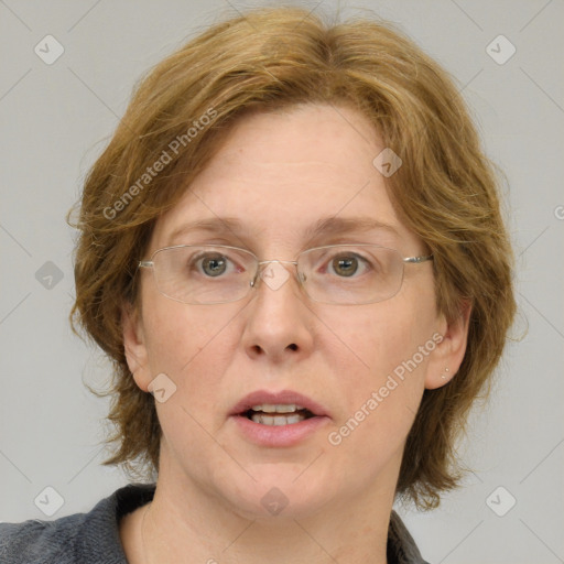 Joyful white adult female with medium  brown hair and blue eyes