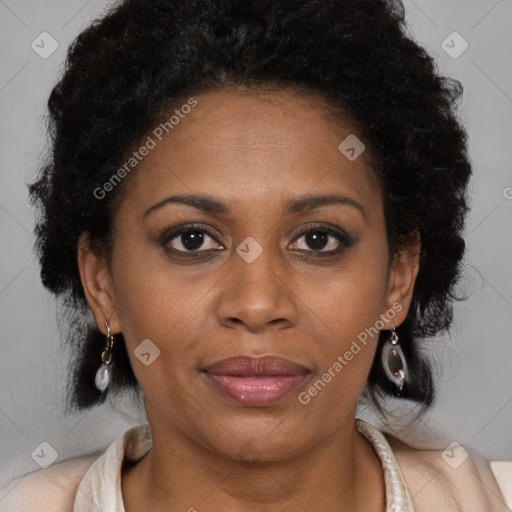 Joyful black adult female with medium  brown hair and brown eyes