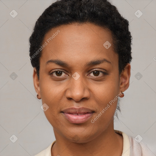 Joyful black young-adult female with short  black hair and brown eyes