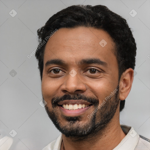 Joyful black young-adult male with short  black hair and brown eyes