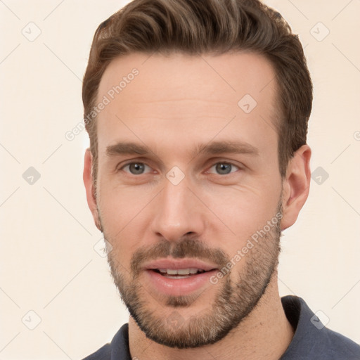 Joyful white young-adult male with short  brown hair and brown eyes