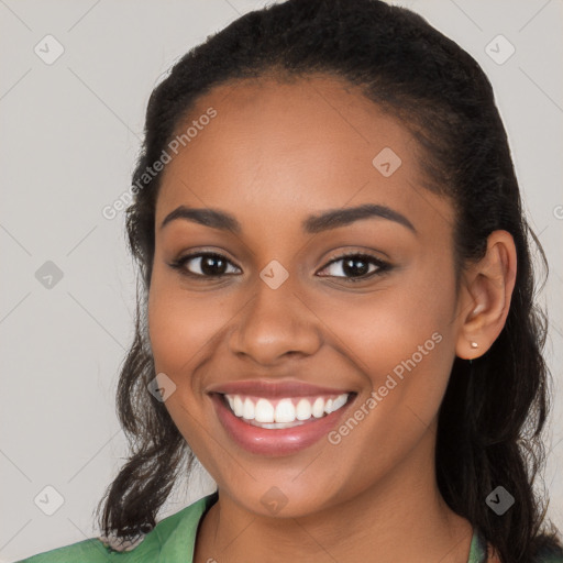 Joyful latino young-adult female with long  brown hair and brown eyes