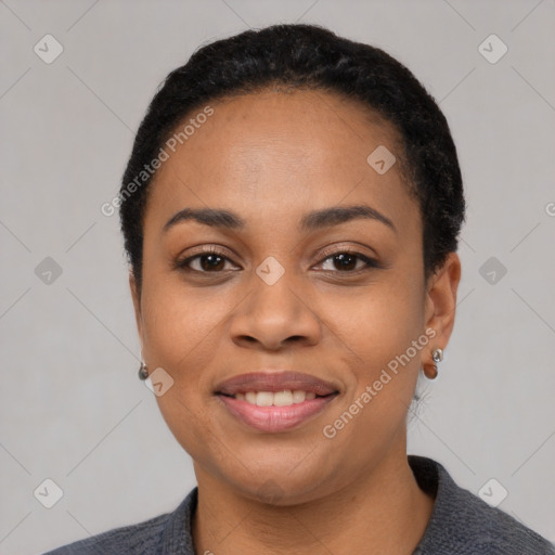 Joyful black young-adult female with short  black hair and brown eyes