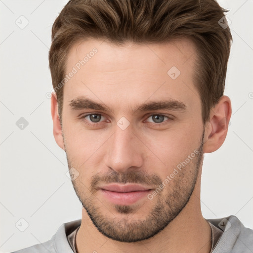 Neutral white young-adult male with short  brown hair and grey eyes