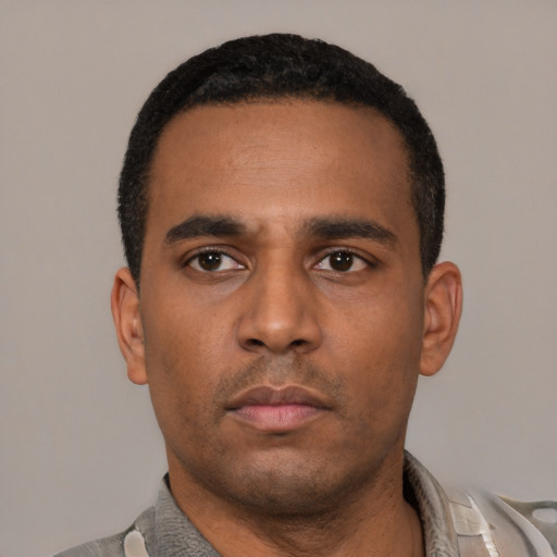 Neutral latino young-adult male with short  black hair and brown eyes