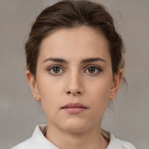 Neutral white young-adult female with medium  brown hair and brown eyes