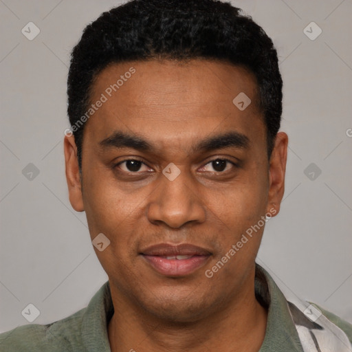 Joyful black young-adult male with short  black hair and brown eyes